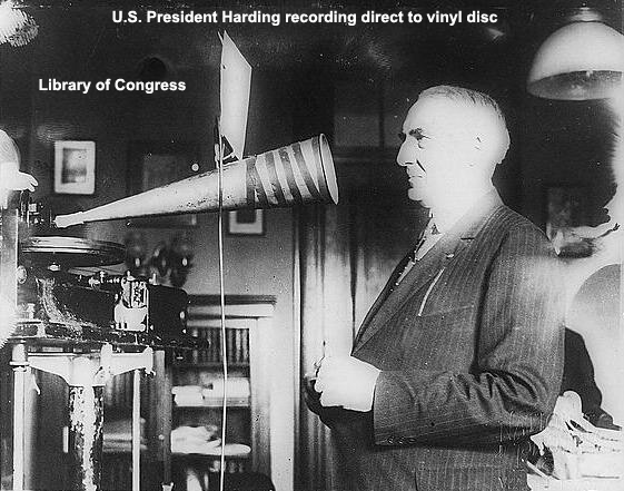 US President Harding recording into recording horn