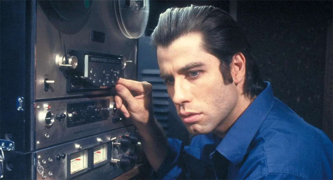 John Travolta with Pioneer reel tape recorder