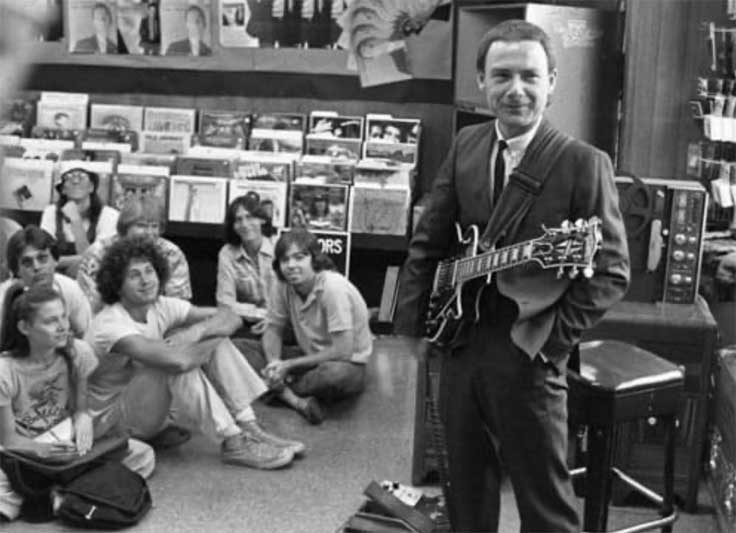 Robert Fripp with ReVox reel tape recorders at record store
